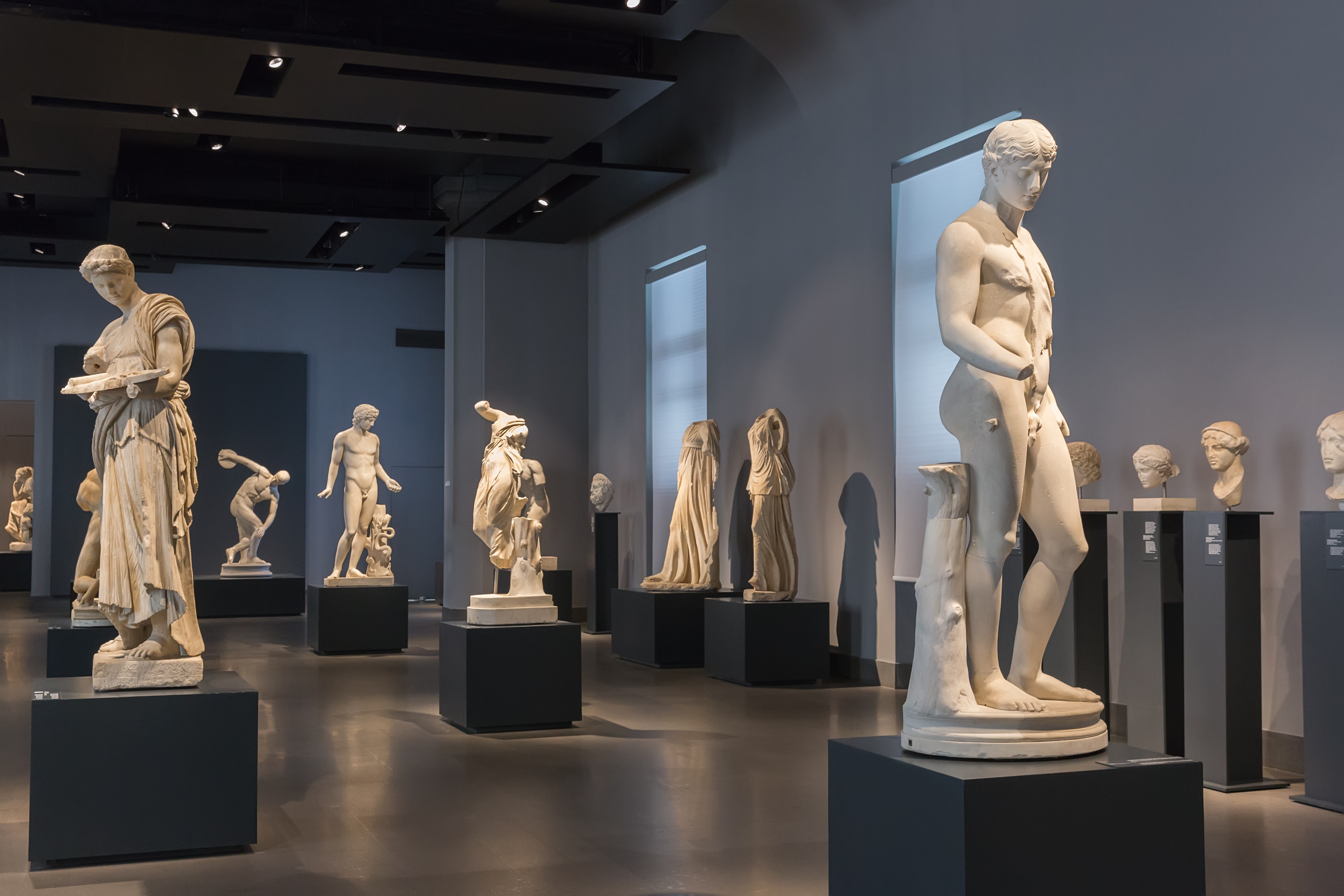 Classic sculptures based on the human form fill a gallery