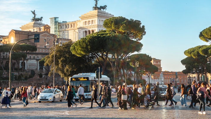 Rome, street with people, bus and taxis, Via dei Fori Imperiali with tourists (Imperial Forums street)